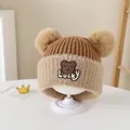 Brown and beige knitted baby bear hat with dual fur pom-poms and fleece ear protection - Style 3 Coffee