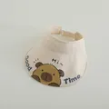 Detail of a creamy white kids' open top sun hat with cartoon bear print and adjustable strap - Type 1 Beige (Capybara)