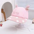 Close-up of pink breathable mesh baby hat with CUTE letter embroidery and polka dot brim - 48-50cm / Pink