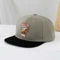 Detail of greyish-green flat brim baseball cap featuring a 3D silicone cartoon bear patch - 50-54cm (3-10 Years) / Gray Green And Black