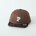 Detailed close-up of brown suede baby baseball cap with leopard print brim and embroidered P - Baby Size / Coffee