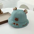 Detail of light blue baby sun hat with cute brown 3D ears and capybara embroidery - 48-50cm / Grass Green