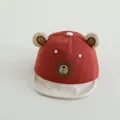 Detailed shot of baby baseball cap featuring plush bear ears and brown leather bear patch - Toddler One Size / Burgundy