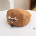 Detail of children's brown beret with bear embroidery and adjustable drawstring buckle - Toddler Size / Dark Coffee