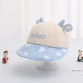 Beige und hellblaue Baby-Sonnenmütze mit süßer Stickerei und blauen Deko-Hörnern - Baby (1-3 Jahre) / NICE Himmelblau