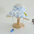 Detail of kids sun hat featuring breathable mesh, cartoon bees and whistle chin strap - Kids (Ages 2-7) / Blue