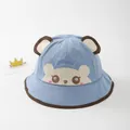 Close-up of light blue baby bucket hat featuring 3D ears and cute bear embroidery - Toddler Size / Sky Blue
