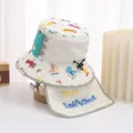 Close-up of white dinosaur sun hat for kids featuring neck protection and colorful patterns - 48-50cm / Off White