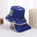 Detail of dark blue baby sun hat with dinosaur prints, neck flap and chin strap - 48-50cm / Sapphire Blue