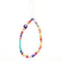 Macro detail of colorful clay and bead phone lanyard featuring a blue evil eye charm - 1 Blue Eye Beaded Phone Charm