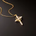 Golden cross necklace for women featuring sparkling cubic zirconia stones on black background - Necklace / Gold