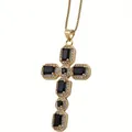 Macro detail of gold cross pendant with black gemstones and micro-pave zircon crystals - Black