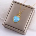 Elegant gold heart pendant necklace with blue opal and zircon on gray jewelry box - Heart Opal Necklace (TZ208-Necklace)