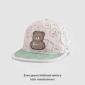 Detail of cartoon bear silicone patch and Kid Bear embroidery on kids' baseball cap - Adjustable Kids Size / Beige