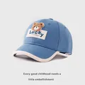Detail of blue kids baseball cap with plush bear embroidery and Lucky patch - Baby 1-3 Years / Blue