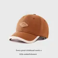 Detail of cotton baseball cap featuring KUKUJI leather patch and contrast piping edge - Toddler 1-3 Years 48-50 / Dark Coffee