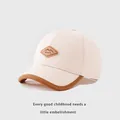 Detail of baby baseball cap featuring Kukuji leather patch and brown contrast piping - Toddler 1-3 Years 48-50 / Beige