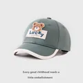 Detail of cotton baseball cap with plush bear patch and Lucky label for toddlers - Baby 1-3 Years / Grass Green