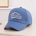 Close-up of blue denim baseball cap featuring 3D white Jeans embroidery and curved brim - Kids 3-10 Years 50-54CM / Dark Blue