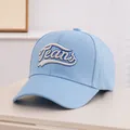 Detail of light blue baseball cap featuring intricate Jeans embroidery and twill texture - Kids 3-10 Years 50-54CM / Sky Blue