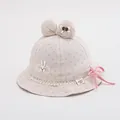Detailed view of pink polka dot baby sun hat with large bow and cute rabbit patch - 48-50cm / Pink Bowknot