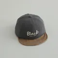 Detailed close-up of grey baseball cap with BLACK embroidery and brown linen brim - 45-48cm (0-3 Years) / Dark Gray