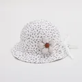 Detail of baby floral bucket hat with 3D fabric flower and white chin strap ties - Toddler Size / Purple Floral on Beige