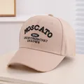Detail of beige baseball cap featuring black embroidered MOSCATO 1996 text and cotton texture - 50-54cm (Kids 3-10 Years) / Khaki