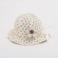 Detailed macro view of baby sun hat with yellow floral pattern and fabric flower decor - Toddler Size / Yellow Floral on Beige