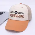 Detail of color-block baseball cap with embroidered lettering and twill cotton texture - Kids 2-7 Years / Orange