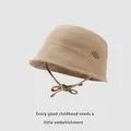 Close-up of khaki cotton sun hat for kids featuring cloud patch and adjustable chin strap - Light Khaki / 48-52cm