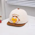 Detail of baby sun hat featuring summer embroidery and a yellow toy propeller ornament - 46-48cm / Coffee
