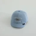 Light blue denim baseball cap for kids with embroidered letters and soft brim detail - 1983 Light Blue