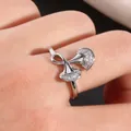 Macro shot of silver ginkgo leaf ring with micro-paved zircons worn on finger - US 7 / Silver