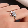 Close-up of double heart ring with micro-pave white zircon on finger for women - US 7 / Silver