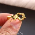 Double heart ring with cubic zirconia in gold finish measuring 1.8cm across - US 7 / Gold