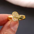 Golden infinity heart ring featuring micro-pave white cubic zirconia stones for women - US 7 / Gold