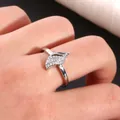 Detail of silver feather ring with micro-paved zircons worn on a finger - US 7 / Silver