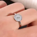 Macro shot of silver circular ring with micro-pave cubic zirconia on a model's finger - US 7 / Silver