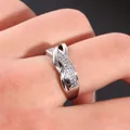 Close-up of double layer infinity ring with micro-set zircons on silver metal band - Size 7 / Silver