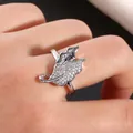 Macro detail of silver double leaf ring with micro-paved zircons and polished finish - US 7 / Silver
