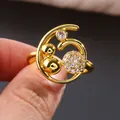 Golden sea wave ring with micro-paved zircons and round beads in a modern design - US 7 / Gold