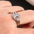 Macro shot of silver sun and moon ring with pavé micro-set cubic zirconia on finger - US 7 / Silver