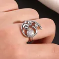 Close-up of silver ring with micro-paved cubic zirconia spheres and hollow band - US 7 / Silver