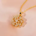 Rotating gold clover pendant necklace with micro-pave zircons on pink silk background - Gold Style (XL2823)