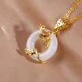 Elegant jade-style circle pendant necklace with gold floral vine and cubic zirconia inlay - Luminous White