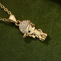 Collier avec pendentif petit garçon hip hop et zircons sur fond vert luxe - 22947-Garçon Doré avec Casquette
