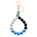 Porte-clés bracelet en perles silicone avec perle bois œil bleu et fermoir doré - Style Mousqueton / Bleu Ciel