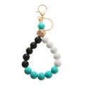Detail of mint green silicone beads with engraved eye pattern on wooden hexagon bead - Lobster Clasp Style (9092-O0102)