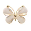 Close-up of a butterfly shoe charm with gold metal frame and colorful glitter inlay - White Rhinestone Butterfly Alloy Accessories